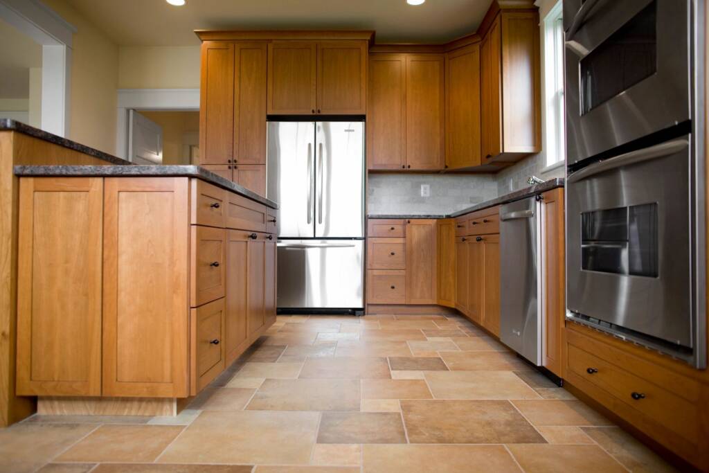 Kitchen with tile flooring and luxury vinyl for Oak Brook properties.