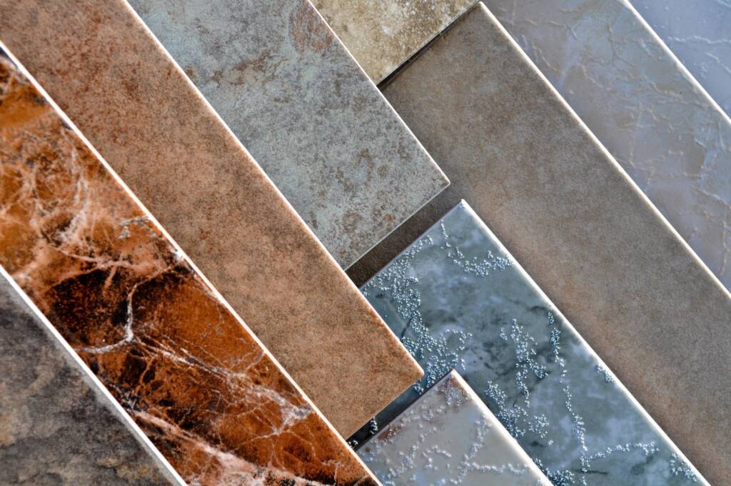 Tile flooring samples showcasing various colors and textures for residential and commercial flooring projects.